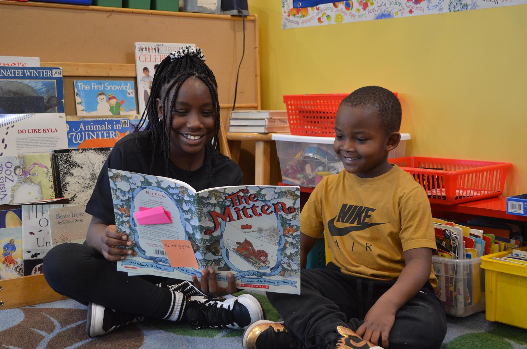 Students reading a book.