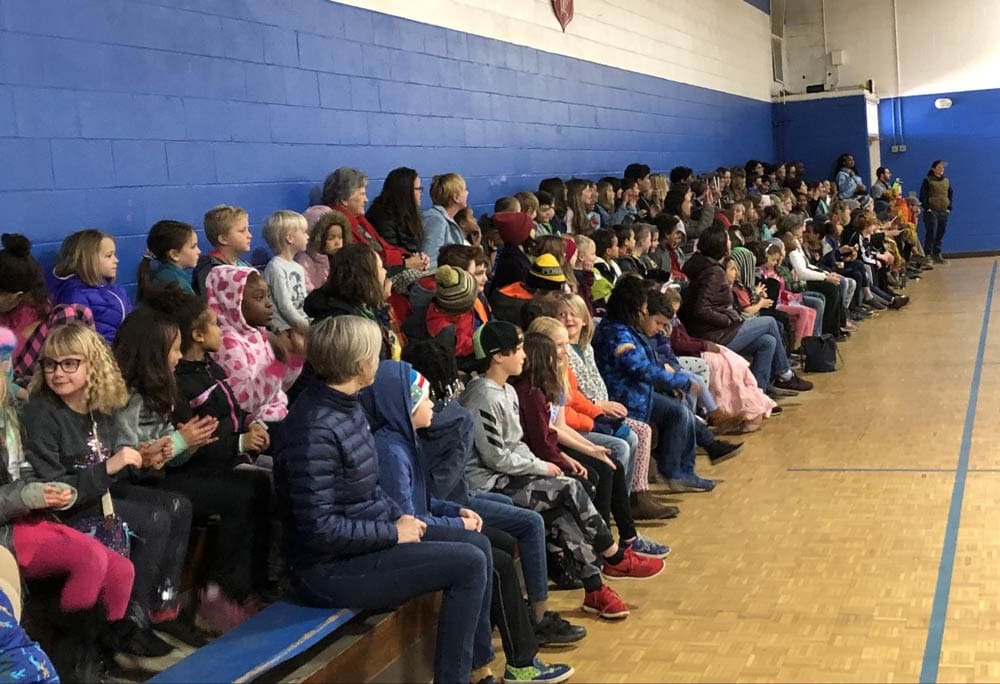 students sitting in auditorium